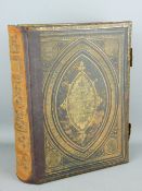 A VICTORIAN FAMILY BIBLE with brass mounts and clasps, leather bound with gilt tooling