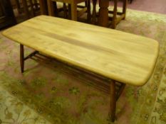 A LIGHT WOOD ERCOL COFFEE TABLE with base rack shelf, 104 x 46 cms