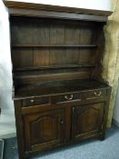 AN 18th CENTURY WELSH OAK DRESSER of neat proportions, 190 cms high, 132 cms wide, 52 cms deep