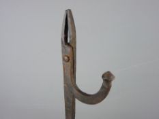 A 19th CENTURY WROUGHT IRON RUSH NIP LIGHT, tall and slender on a tripod foot, 36 cms high