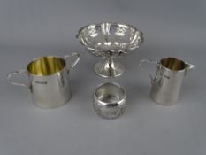 FOUR ITEMS OF SMALL SILVER to include a bachelor set of milk jug and sugar bowl, a pierced bon bon