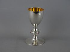 A BELIEVED SILVER, GILT INTERIOR CHALICE on a collared stem with circular foot, the collar having