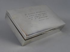 A SILVER CIGARETTE BOX, Chester 1930, 16.75 cms long