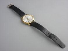 A GENT'S OMEGA GENEVE AUTOMATIC WRISTWATCH with leather strap, baton markers and date aperture