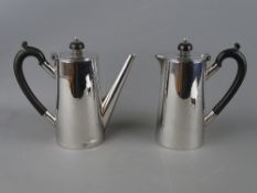 A SILVER COFFEE POT & MATCHING HOT WATER JUG, Sheffield 1934, 26.4 troy ozs gross, 17 cms