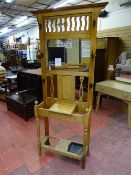 A VINTAGE BLONDE OAK MIRRORED HALLSTAND, 199 cms high, 93 cms wide overall, 27.5 cms deep