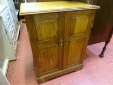 Small two door oak cabinet