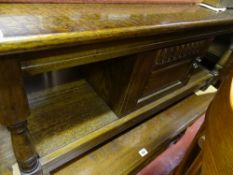 Reproduction oak coffee table with central storage cupboard
