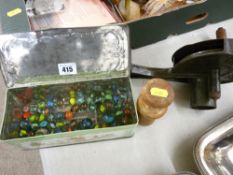 Vintage cast iron marmalade cutter and a tin of vintage marbles