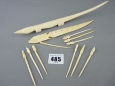 Two carved bone letter openers and a quantity of tooth picks
