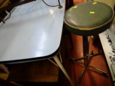 Metal legged table with blue Formica top and a vintage rise and fall bar stool