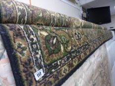 Green ground woollen rug