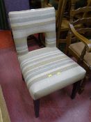Interesting multi-striped upholstered chair with cut-out back
