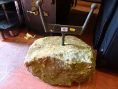 Heavy doorstop rock with boot scraper