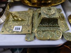Brass inkwell and a brass sundial