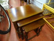 Polished wood nest of three coffee tables