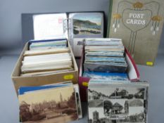 Collection of vintage postcards contained in two shoe boxes and two albums, various subjects