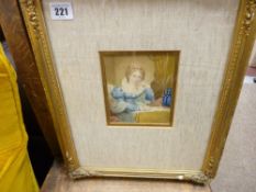 Watercolour - young lady in blue dress writing at a table, indistinctly titled verso with date 1838