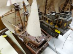 Two model galleons with sails