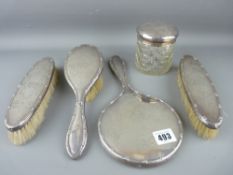 Five piece silver mirror and brush with covered jar dressing table set