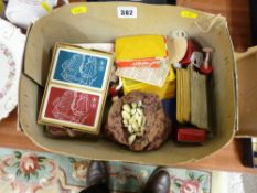 Box of vintage playing cards and a bag of marbles etc