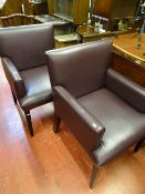 Pair of modern purple faux leather office chairs