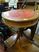 Circular leather topped drum shaped occasional table with side drawers