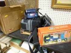 Boxed Britains farm Land Rover and horse box, an old tennis racquet and frame and an Aldis projector