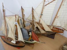 Four model yachts
