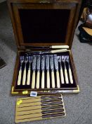 Canteen of six bone handled fish knives and forks, pair of meat carvers and a set of six wooden