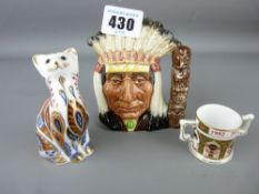 Royal Doulton North American Indian character jug, Royal Crown Derby cat and a Royal Crown Derby