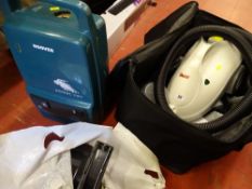 Polti steam cleaner in a canvas carry bag and a Hoover Sprint 1000 vacuum cleaner E/T