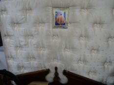 Sealy Posturepaedic mattress and dark wooden headboard