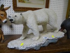 Country Artist polar bear on a rock, approximately 46 cms long