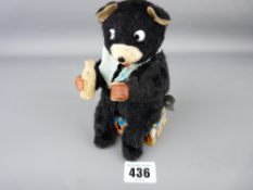 Tinplate and fabric model of a drinking wind-up bear