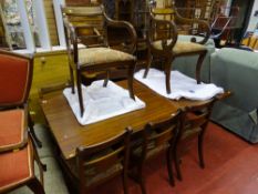 Polished wood dining table with six (four plus two) dining chairs