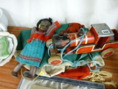 Parcel containing an old doll, wooden train, Welsh flag etc