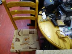 Circular pine dining table and two ladderback pine chairs