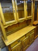 Light wood kitchen dresser having three upper glazed and three lower doors