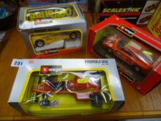 Three bubble packed Burago scale model vehicles