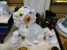 Three Staffs dogs and a graduated set of jugs