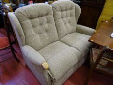 Beige two seater couch