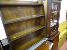 Polished wood corner cupboard with upper glazed door and a four shelf bookcase