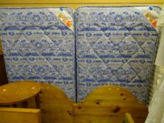 Pair of single divan beds with pine headboards