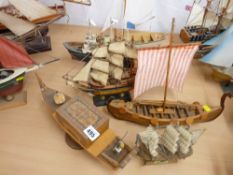 Six various model yachts, 'Dhows' and one of the Royal Yacht Britannia