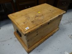 A small pine chest with cast iron carry handles