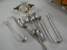 A hallmarked silver tea strainer, WWII medal, two hallmarked sugar tongs, EPNS spoons etc