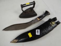 A kukri knife in scabbard & flat iron
