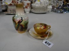 A miniature Royal Worcester cup & saucer decorated by Stinton (A/F) together with a small Royal