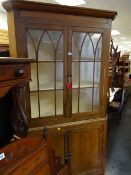An antique light oak astragal glazed standing corner farmhouse-cupboard